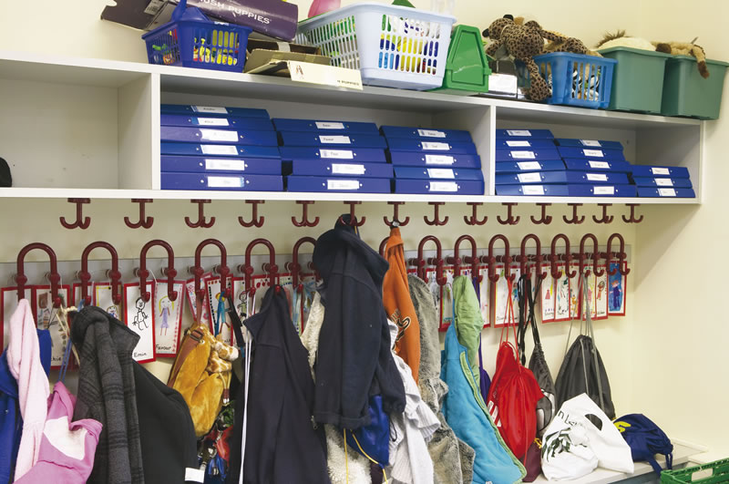 Bespoke shelving above clothes pegs to increase storage space